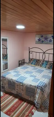 a bedroom with a large bed in a room at Casa da Tita