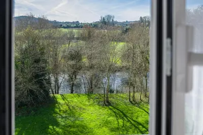 a view of a river from a window at Mirador del Tambre Etapa final del Camino in Sigüeiro