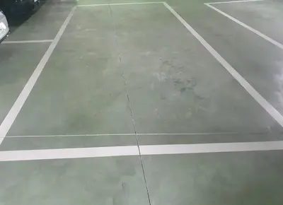 an empty parking lot with white lines on it at O lar da luz in Ourense