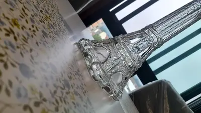 a glass trophy hanging from a window at Ameli House By PECA in Silleda
