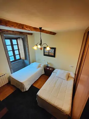 a bedroom with two beds and a window at Private Entire Home ,Old Town 6-min Walk to Cathedral in Santiago de Compostela