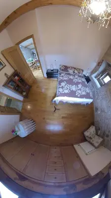 a room with a bed in the middle of a attic at Private Entire Home ,Old Town 6-min Walk to Cathedral in Santiago de Compostela
