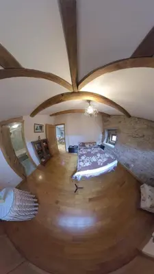 a large room with a bed and a wooden floor at Private Entire Home ,Old Town 6-min Walk to Cathedral in Santiago de Compostela
