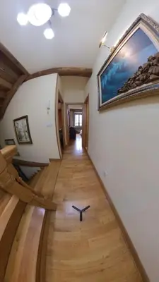 a hallway in a house with a painting on the wall at Private Entire Home ,Old Town 6-min Walk to Cathedral in Santiago de Compostela