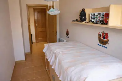 a bedroom with a bed in a room at Winahost Ático Viveiro in Viveiro