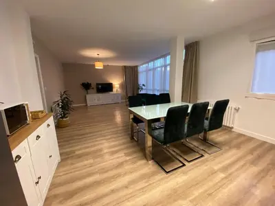 a living room with a dining room table and chairs at Pensión Camino del Sil in Sobradelo