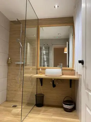 a bathroom with a sink and a shower at Pensión Camino del Sil in Sobradelo