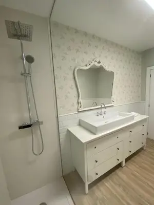 a white bathroom with a sink and a mirror at Pensión Camino del Sil in Sobradelo