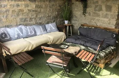 a living room with a couch and a table and chairs at Mirador de Babia II in Ríolago