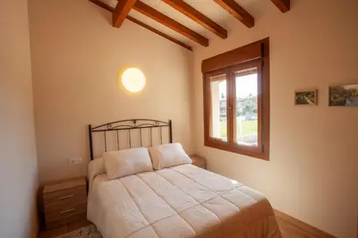 a bedroom with a bed and a window at YourHouse Casa Canastro in Allariz