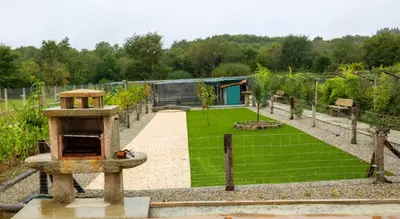 a stone structure in a park with a train track at YourHouse Casa Canastro in Allariz