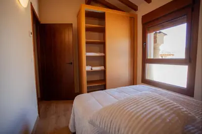 a bedroom with a bed and a window at YourHouse Casa Canastro in Allariz