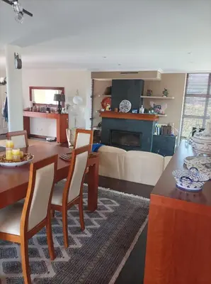 a kitchen and living room with a table and chairs at Casa D Aitana in Pardaces de Arriba