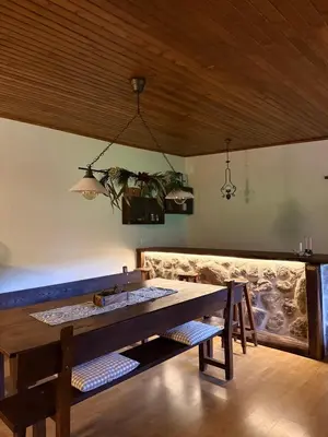 a dining room with a table and a sink at O Caliu das Airas in León