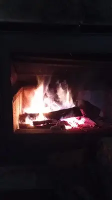 an oven with a fire in it at O Caliu das Airas in León