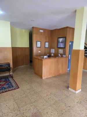 a lobby with a reception desk in a building at Hotel Espada in A Rua