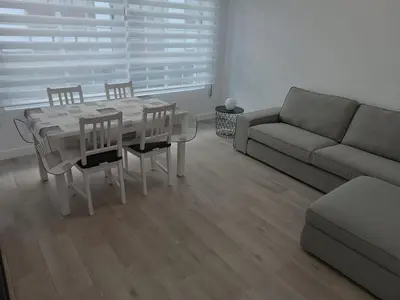 a living room with a table and a couch at Vivienda Ares Centro in Ares