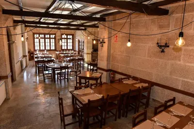a restaurant with tables and chairs in a room at Casa Palomin