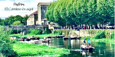 a group of boats in a river with people on a bridge at Apartamento Padrón Centro, A de Marcelino by URent in Padrón