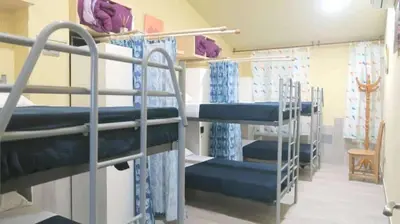 a group of bunk beds in a room at Albergue Ezequiel in Melide