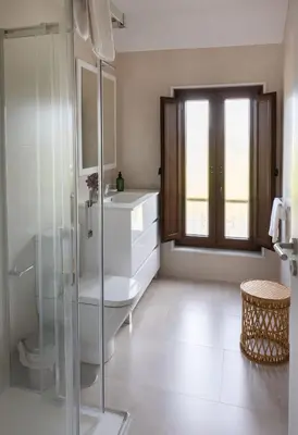 a bathroom with a shower and a toilet and a sink at Casa Aradas in Santiago de Compostela