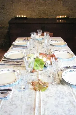 a table with plates and glasses and food on it at Holiday Home mit Privatpool by Interhome in Parada del Sil