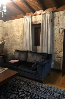 a black leather couch sitting in a living room at Holiday Home mit Privatpool by Interhome in Parada del Sil