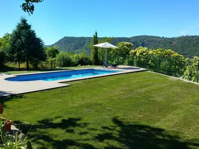 a backyard with a swimming pool and a grass yard at Holiday Home mit Privatpool by Interhome in Parada del Sil