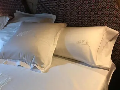 a bed with two white pillows on it at Holiday Home mit Privatpool by Interhome in Parada del Sil