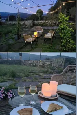 a table with two glasses of wine and a slice of pizza at Holiday Home Galicia Retreat by Interhome in Cerdedo