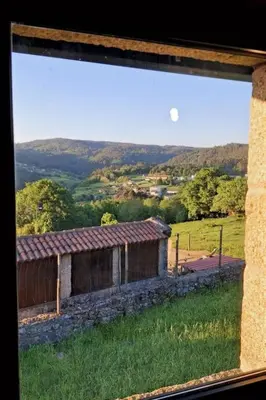 a window view of a building in a field at Holiday Home Galicia Retreat by Interhome in Cerdedo