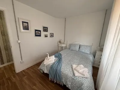 a bedroom with a bed with towels on it at Torkes in Foz