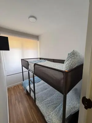 a bedroom with a bunk bed in a room at Torkes in Foz