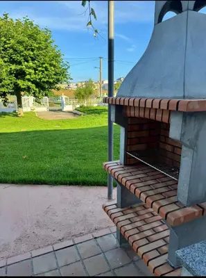 a brick oven sitting next to a park at Torkes in Foz