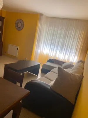 a living room with two couches and a table at Barreiros in Barreiros
