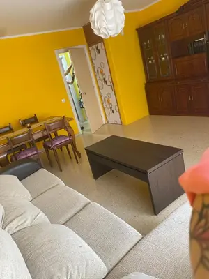 a living room with a couch and a table at Barreiros in Barreiros