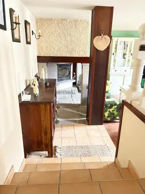 a view from the hallway into a living room with a fireplace at Casa de la fuente de Vista Alegre in Sarria