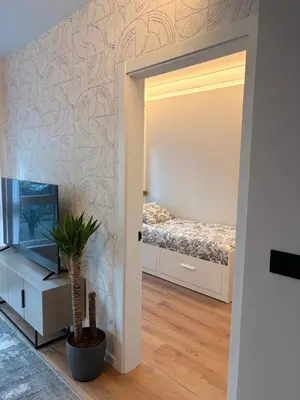 a bedroom with a bed and a mirror at Milagrosa Square in Lugo