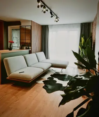 a living room with a white couch and a table at Apartamento Moderno en el Centro !-CheckHostProfile-! in Lugo