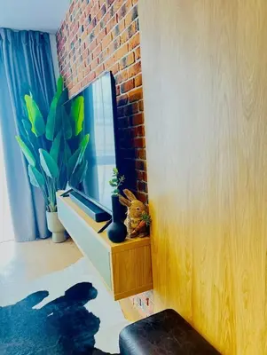a room with a table with a plant and a window at Apartamento Moderno en el Centro !-CheckHostProfile-! in Lugo