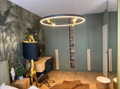 a living room with a large light fixture at Apartamento Moderno en el Centro !-CheckHostProfile-! in Lugo