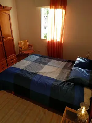 a bedroom with a blue bed with a window at Apartamento Moderno en el Centro !-CheckHostProfile-! in Lugo