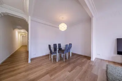 a dining room with a table and chairs at Apartamento dentro de la Muralla de Lugo, Rúa Nova in Lugo