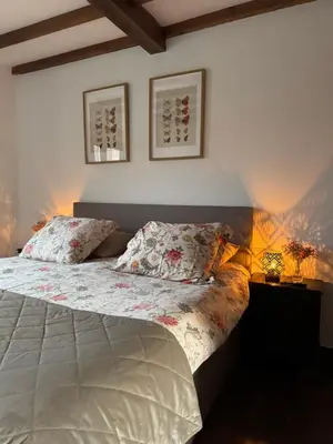 a bedroom with a bed with two pillows on it at Cima de Vila in Taboada
