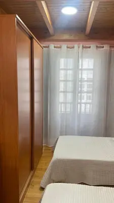a bedroom with two beds and a window at Nido 33 in Ribadeo