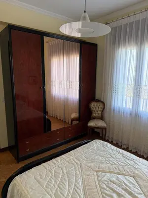 a bedroom with a large mirror next to a bed at Villa Laxes in Burela de Cabo