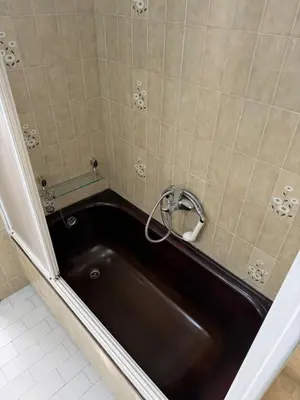 a bath tub with a sink in a bathroom at Villa Laxes in Burela de Cabo