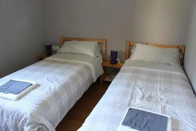 two beds sitting next to each other in a room at Casa Do Ferreiro - La Fragua in Las Herrerías