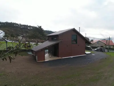 a small house in a field next to a yard at Vencello Estelar Compostela in Santiago de Compostela