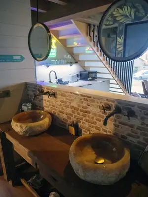 two large wooden sinks on a counter in a room at Vencello Estelar Compostela in Santiago de Compostela